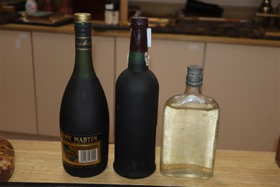 A bottle of Remy Martin, a bottle of Tawny port and a bottle of gin